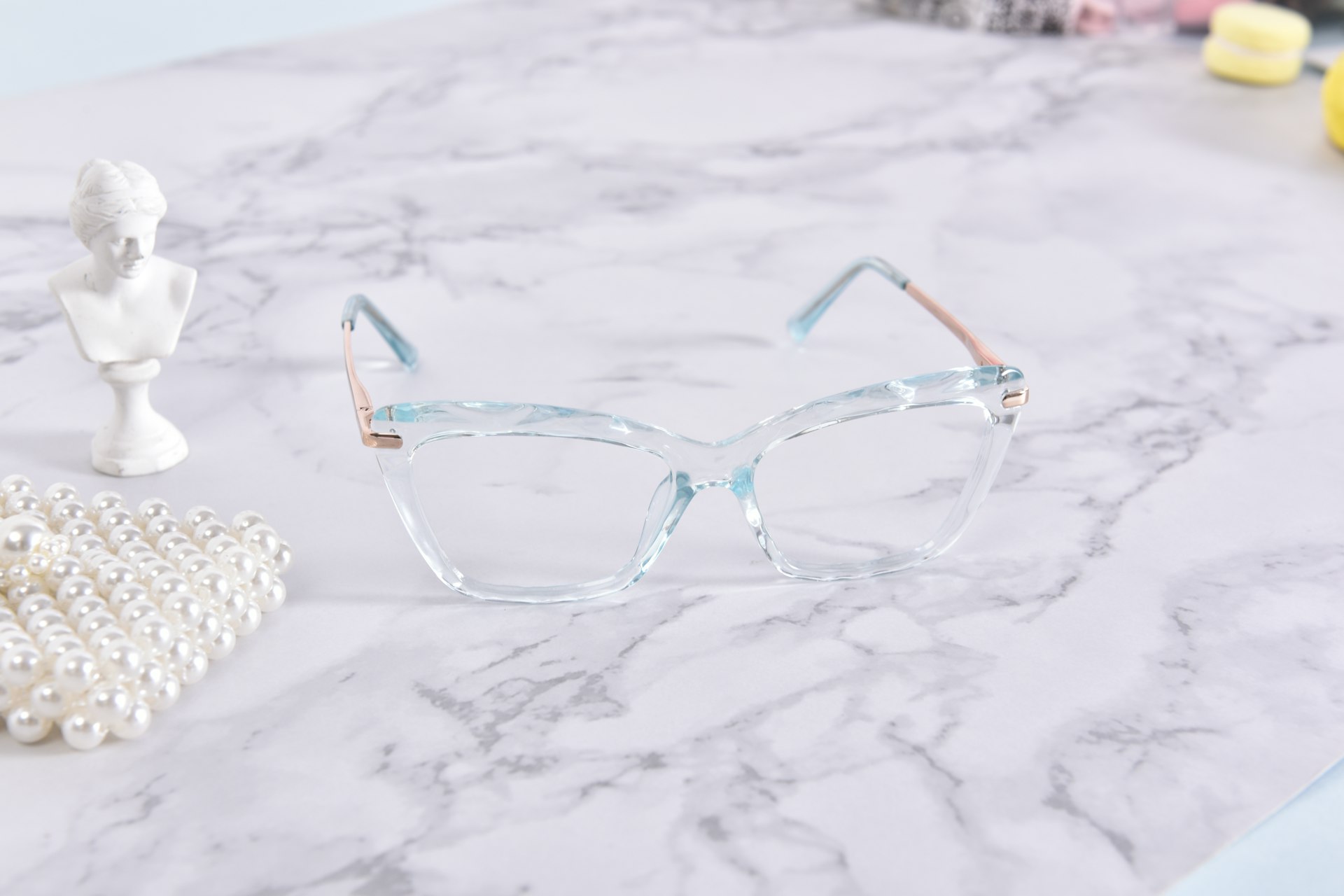 A pair of glasses sitting on top of a table